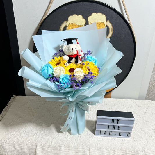 Graduation Bear with Soap Sunflower and Roses Bouquet - Light Blue