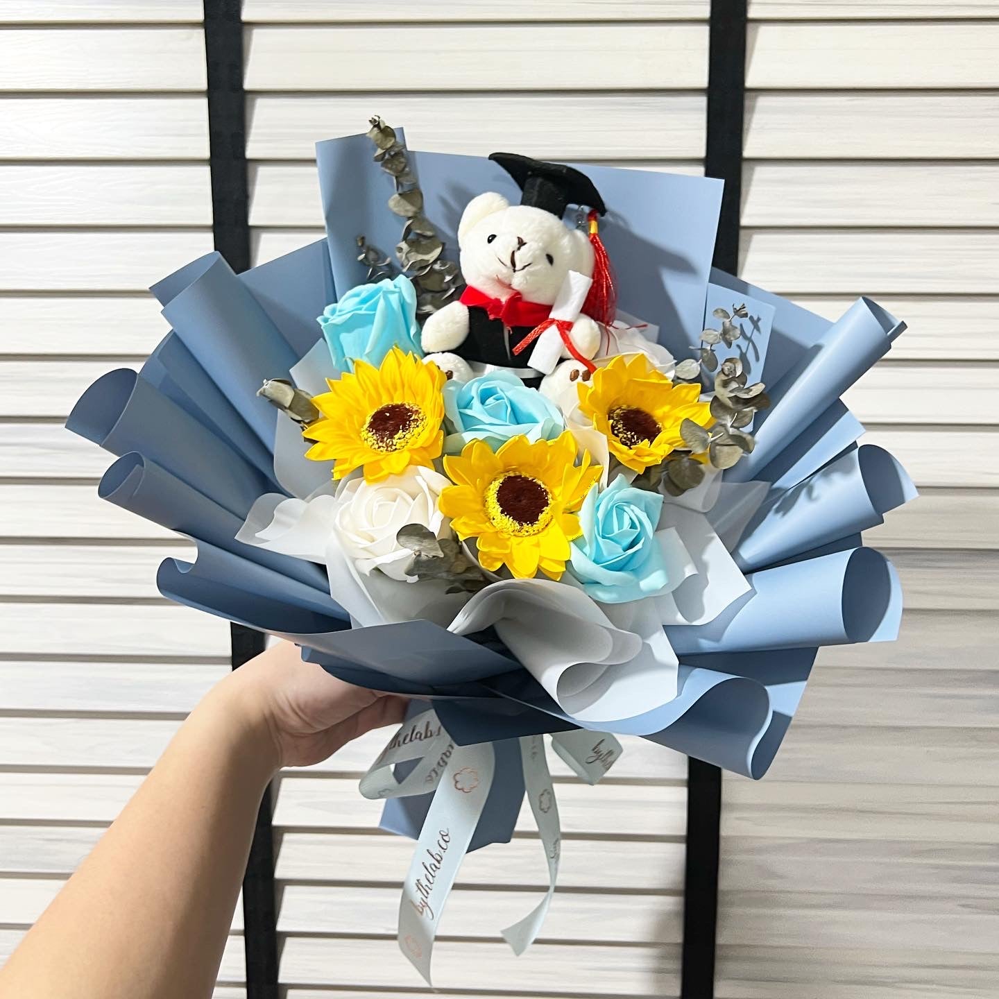 Graduation Bear with Soap Sunflower and Roses Bouquet - Blue